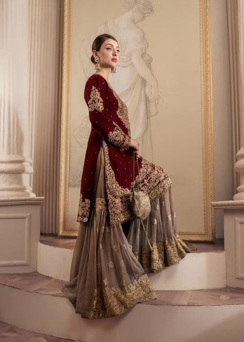 Heavily Embroidered Party Wear Chiffon Gharara in Maroon and Beige with Potli bag