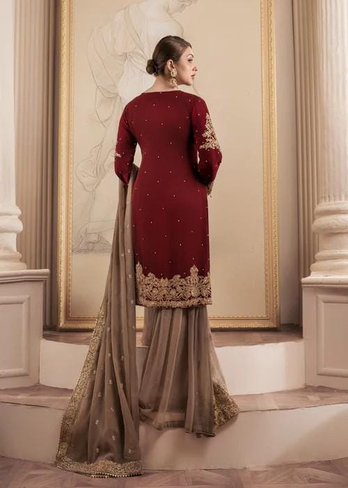 Heavily Embroidered Party Wear Chiffon Gharara in Maroon and Beige with Potli bag