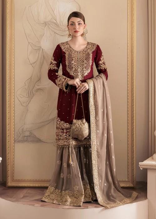 Heavily Embroidered Party Wear Chiffon Gharara in Maroon and Beige with Potli bag